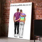 Affiche personnalisée couple hommes posée au sol sur mur de briques rouges, entourée de cadres