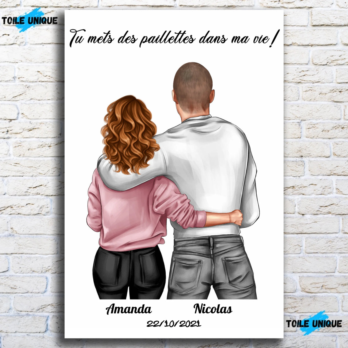 Tableau couple personnalisé homme et femme sur toile, accroché sur un mur de briques blanches (vue 2)
