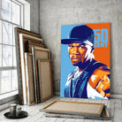 Tableau Décoratif 50Cent sur toile, posé devant des cadres empilés près d'une fenêtre