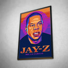 Tableau Décoratif Jay-Z en affiche encadrée noire, vue inclinée sur un mur gris