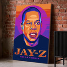 Tableau Décoratif Jay-Z sur toile, posé au sol contre un mur de briques rouges