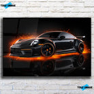 Tableau Décoratif Porsche 911 Black en verre acrylique, vue de face sur un mur de briques blanches
