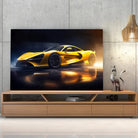 Tableau Décoratif Supercar Mc Claren sur toile, posée sur un meuble TV en bois devant un mur en béton