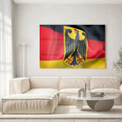Tableau Drapeau Allemagne en verre acrylique, accroché dans un salon lumineux au-dessus d'un canapé beige