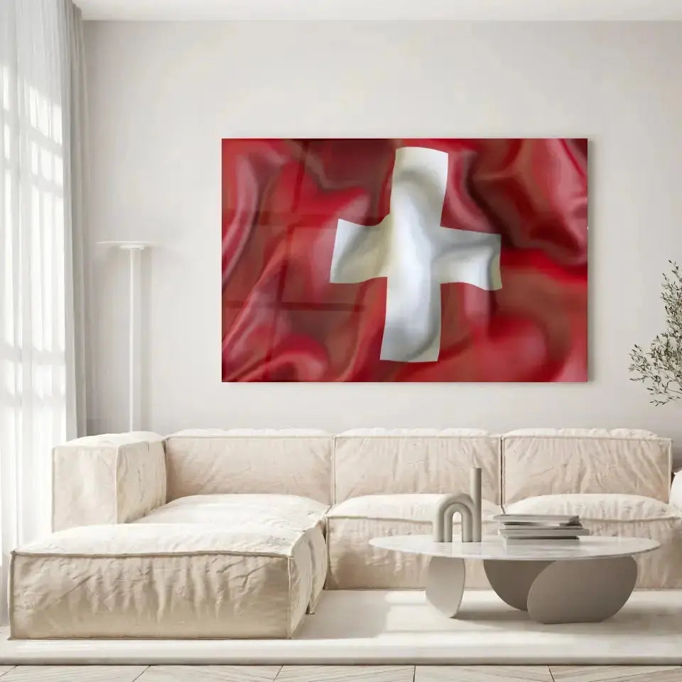 Tableau Drapeau Suisse en verre acrylique, accroché dans un salon lumineux au-dessus d'un canapé beige