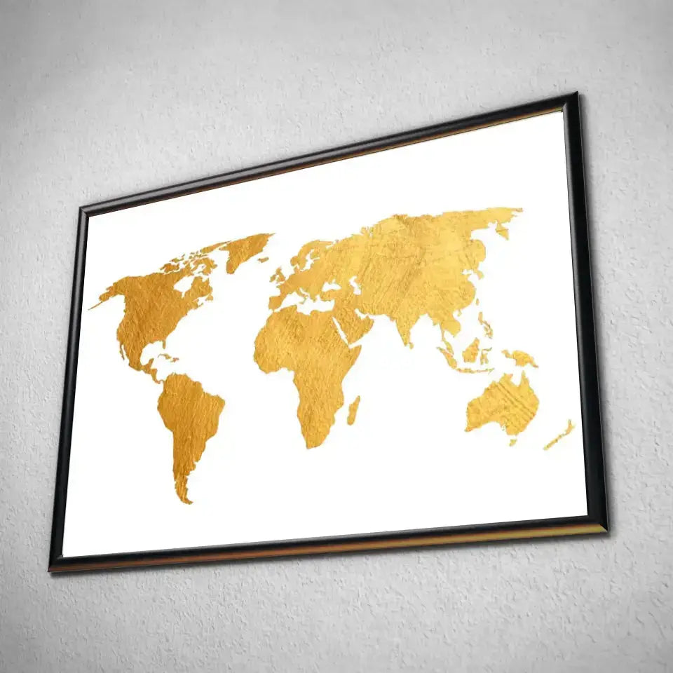 Tableau Décoratif Map Monde Fond Blanc en affiche dans un cadre noir, vue inclinée sur un mur gris