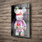 Tableau Street Art Kaws Bearbrick en verre acrylique, fixé sur un mur de pierre