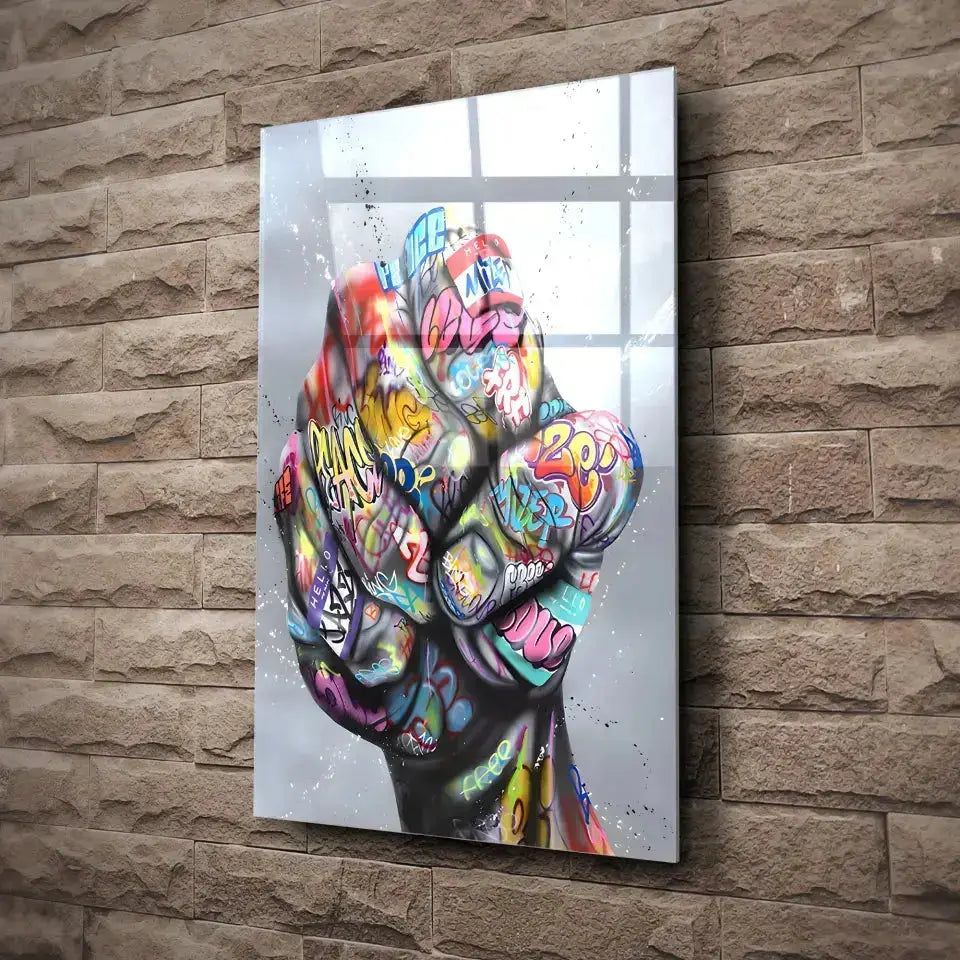 Tableau Street Art Poing de Révolte en verre acrylique, fixé sur un mur de pierre
