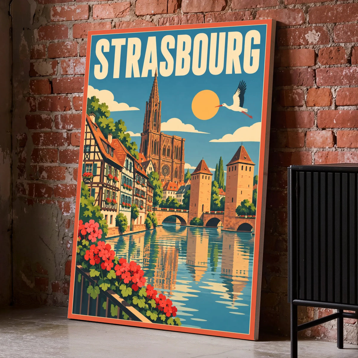 Toile décorative Strasbourg posée au sol sur un mur de briques